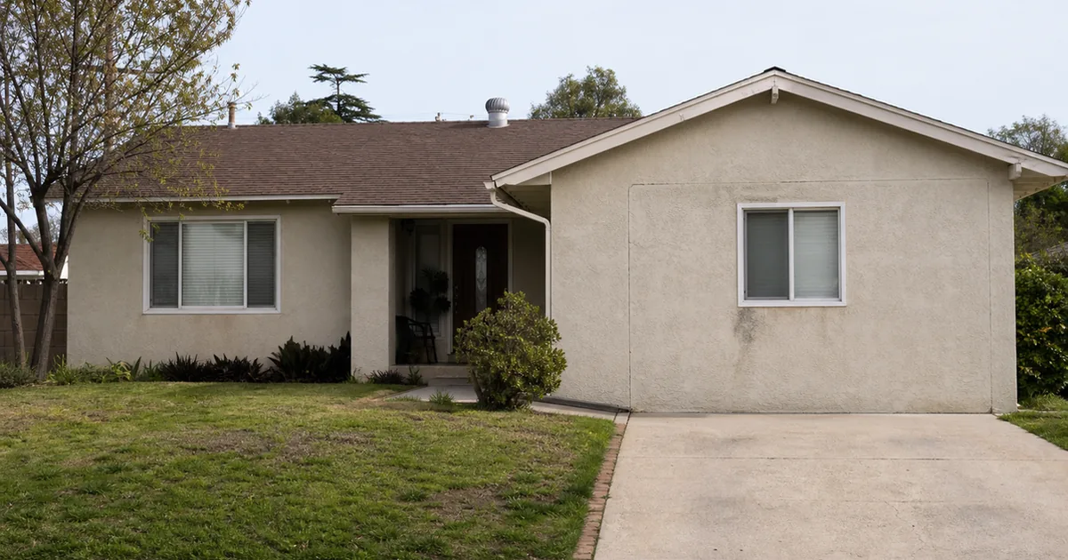 Converted garage on a Van Nuys home where the garage door was replaced with a wall and window